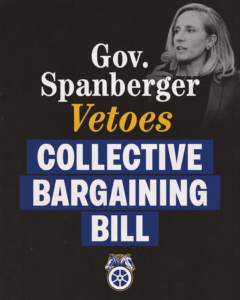 Poster featuring a woman politician speaking into a handheld microphone, with bold text announcing a veto on a collective bargaining bill and blue banner blocks across the poster.