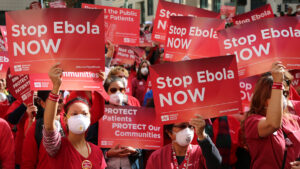 Nurses holding signs