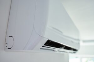 Close-upViewOfModernAirConditioningUnitMountedOnWhite - USA Works