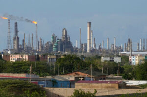 Flames rise from flare stacks at the Amuay refinery in Venezuela.