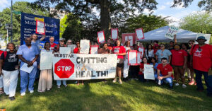 DC Forum Addresses Postpartum Unit Closure and Medicaid Cuts Impact - USA Works - USA Works Large group of nurses and community outside hospital, holding signs and banner