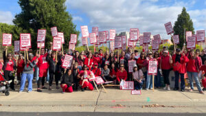 Kaiser Permanente Nurses Secure Millions in Wage Theft Settlement - USA Works - USA Works Large group of nurses outside holding signs